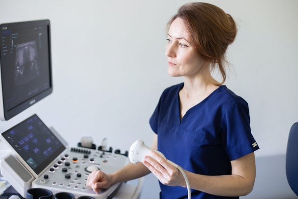 doctor woman doing ultrasound scanning diagnostic