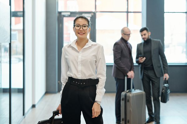 happy young successful female business traveler