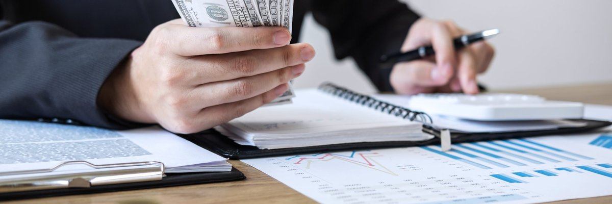 businessman accountant counting money and making