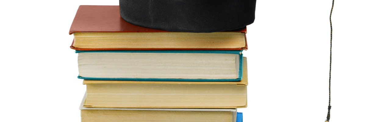 grad hat and diploma with book