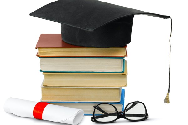 grad hat and diploma with book