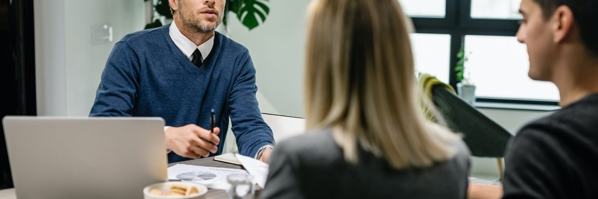 insurance agent having a meeting with a couple